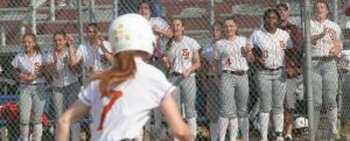 Brittany Mairano heads home, as the St. Joseph dugout reacts to Hannah Hutchson's two-out base hit.