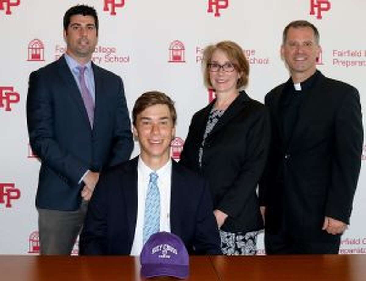 Nick Stachurski is pictured with Athletic Director Tom Curran, mother Susan Sieber and Pres. Rev. Tom Simisky, S.J.