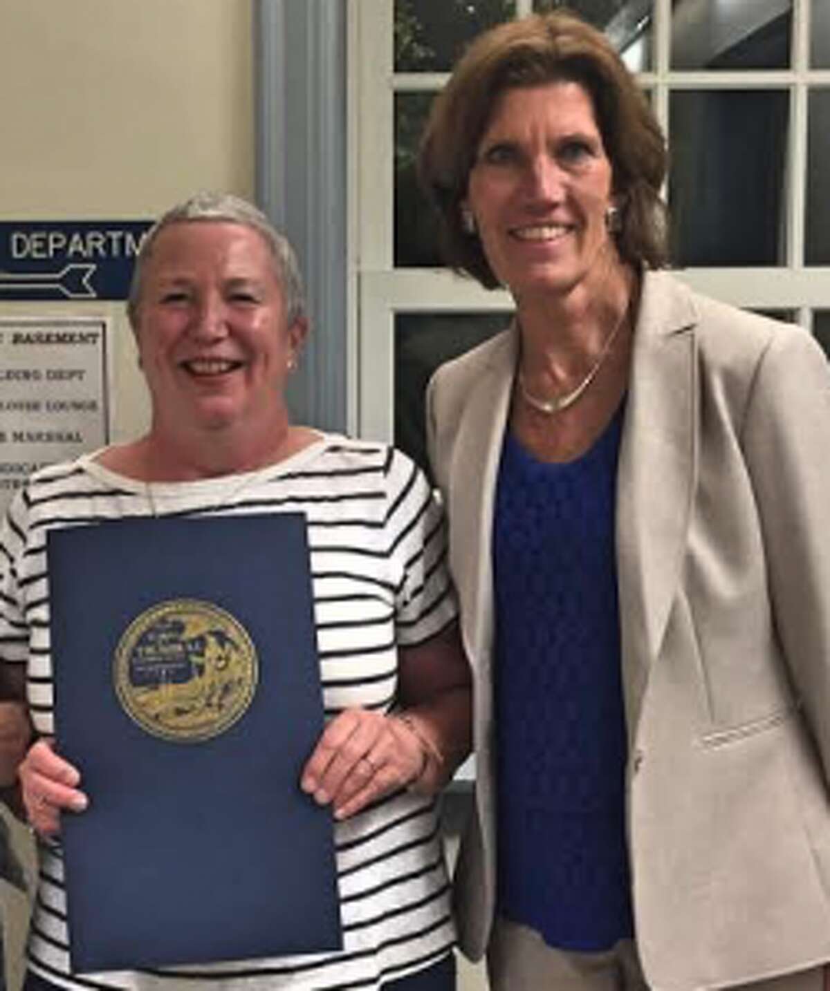 Joanne Sloan, left, with Principal Mary Ellen Bolton, recently received a proclamation from the Town Council in honor of being named state Nurse of the Year.