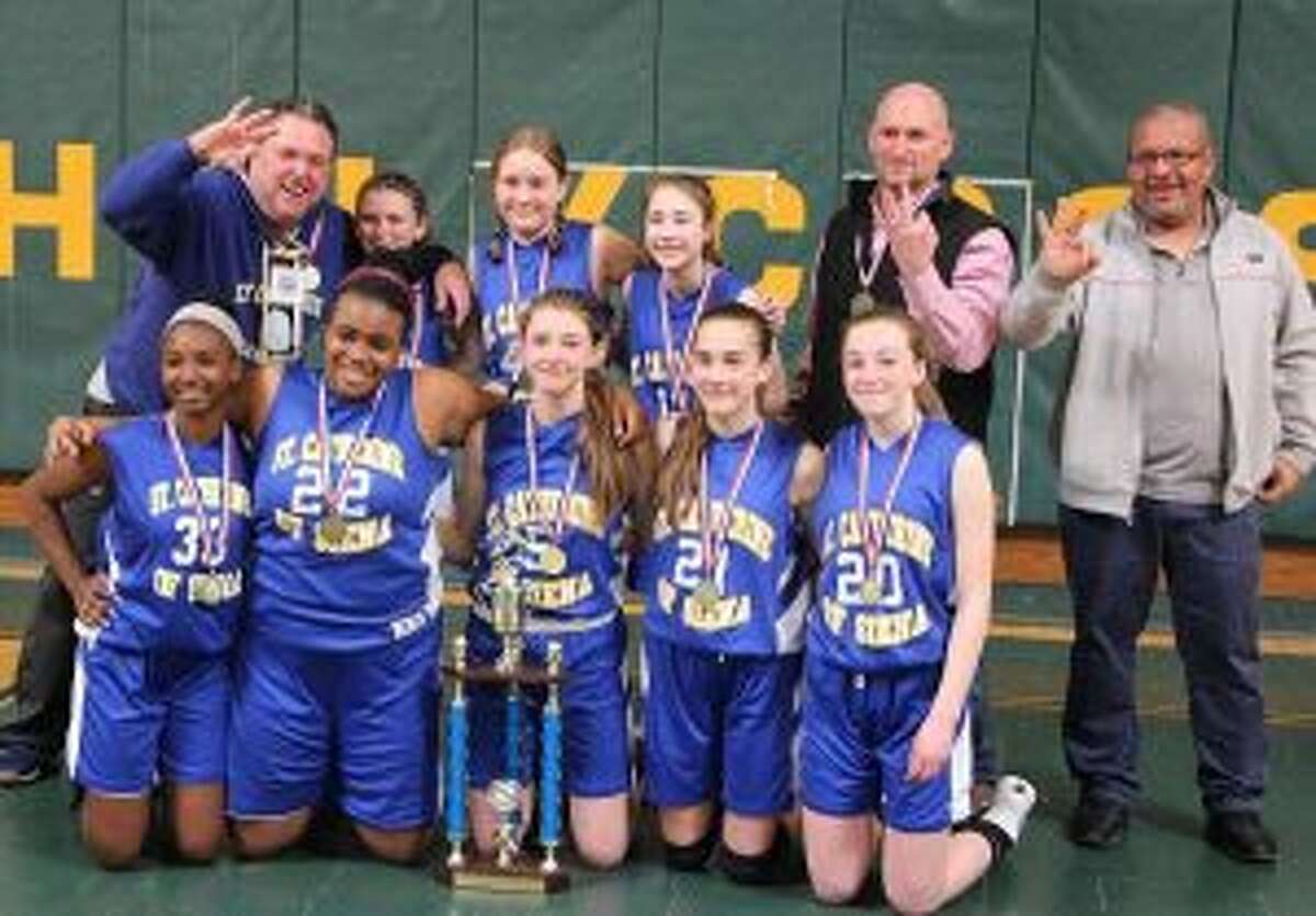 St. Catherine of Siena team members (front row) are: Maxannie Byron, Kirsten Rodriguez, Kate Rudini, Rosa Rizzitelli and Annie Stook; (second row) coach David Rudini, Bella Basso, Rosie Alibrandi, Maria Rizzitelli, coach Steve Basso and coach Miguel Rodriguez. Missing from photo is Hannah Silva.