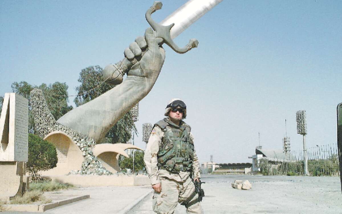 Captain Jeorge Jay King, shown here at the Swords of Qādisīyah monument in Baghdad, is the 2018 Memorial Day Parade Grand Marshal. The monument, sometimes called the Hands of Victory, commemorates the 1980-88 Iran-Iraq War.