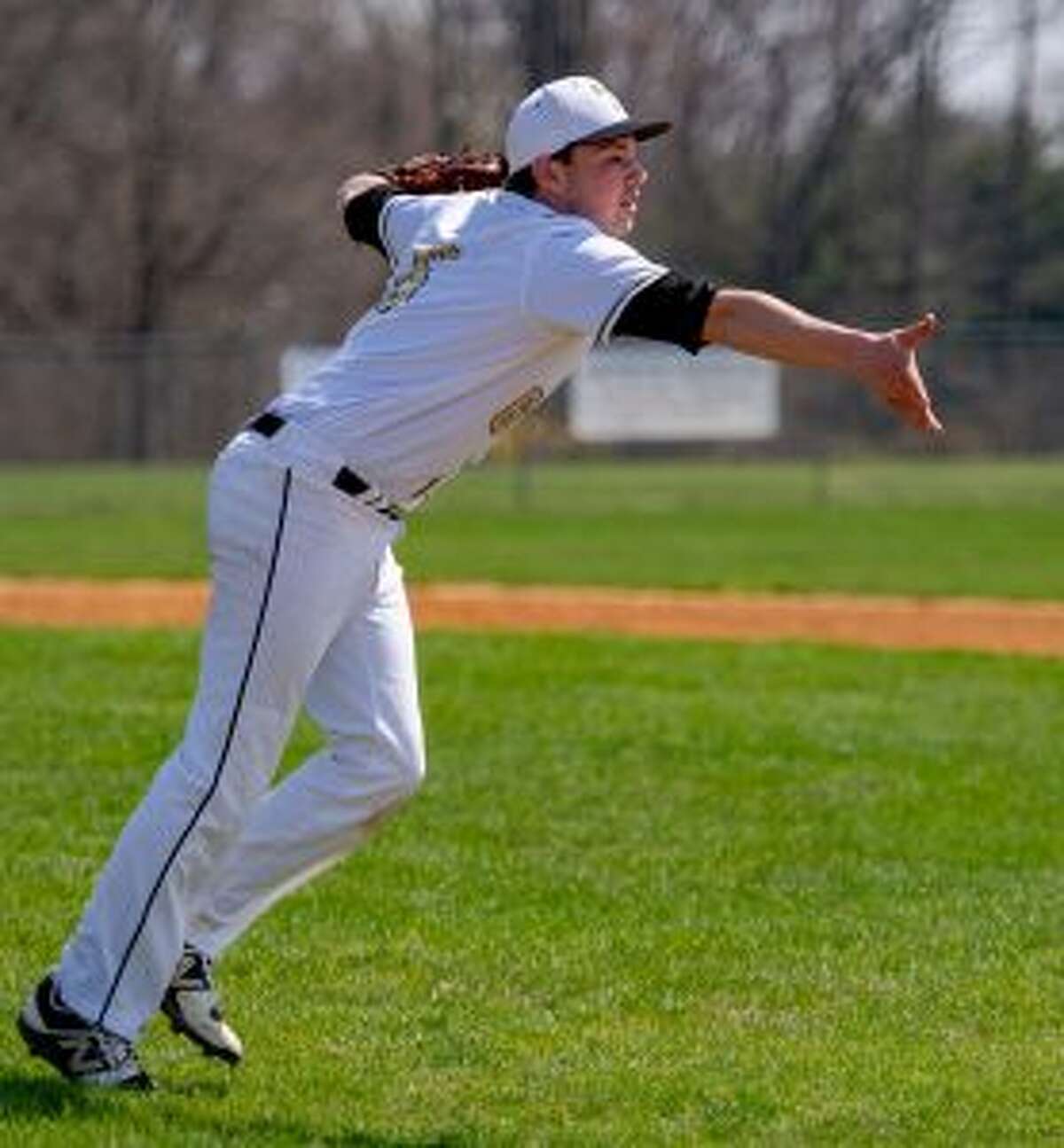 Evan Warner makes a toss to first base in the sixth inning. — David G. Whitham photo