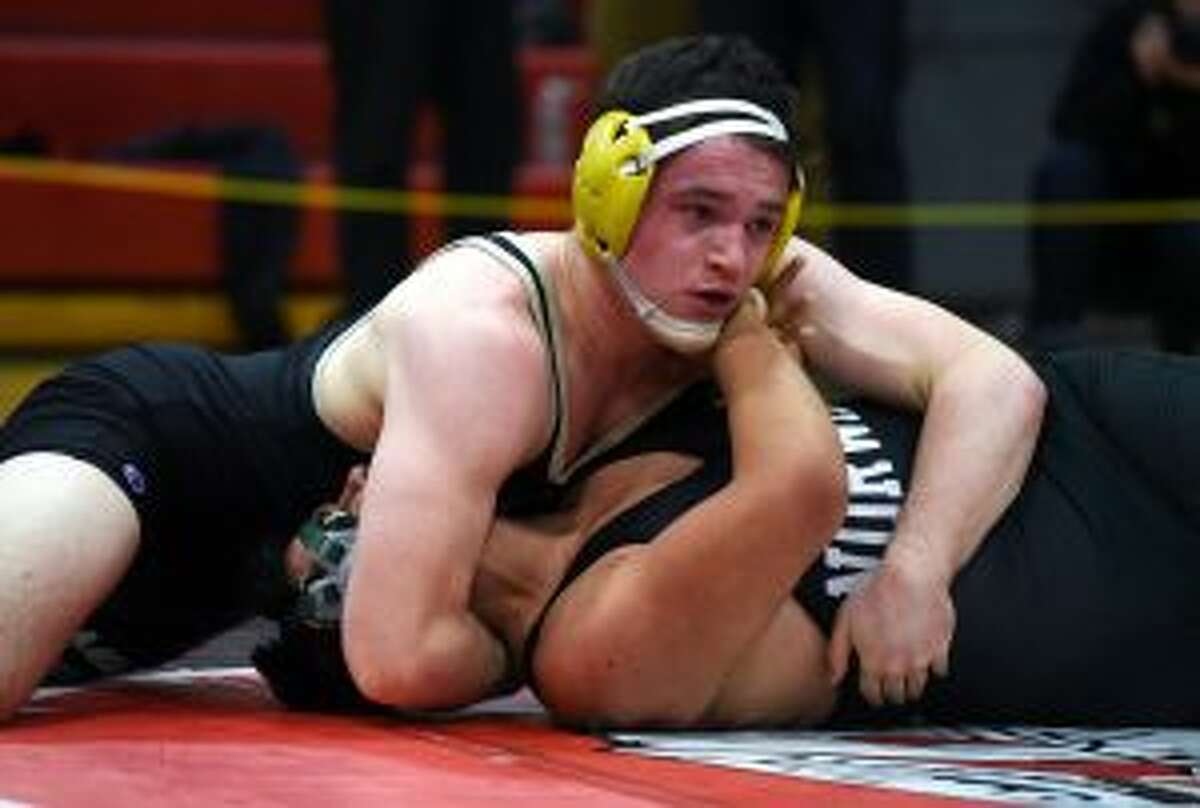 Trumbull 195-pounder Brett Nutter advanced to the semifinals with a pin of Norwalk's Sandro Martinez. — Dave Stewart photo