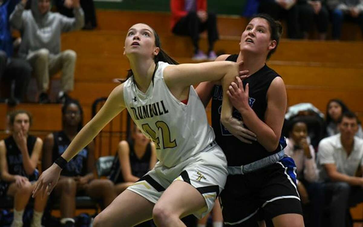 Trumbull's Brady Lynch battles Darien's Rachel Stobbie for a rebound during the FCIAC quarterfinals Saturday in Norwalk. — Dave Stewart photo