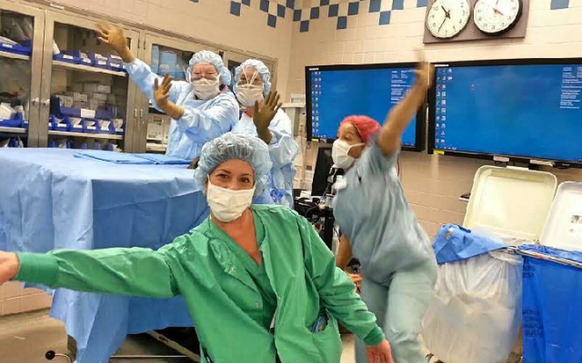 Karen Marlin and coworkers in a lighter moment at the Bridgeport Hospital operating room. — Isabel Perez photo