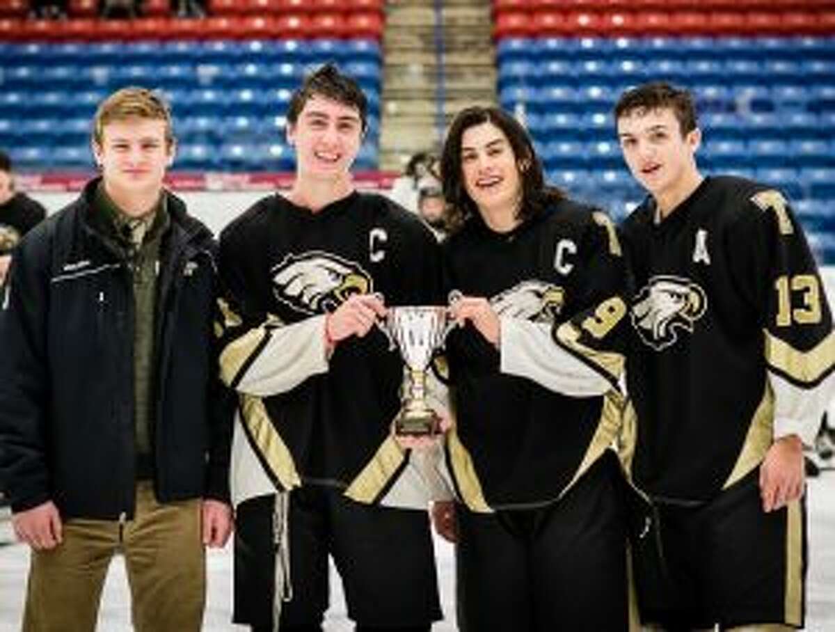 Trumbull High boys hockey captains Luke Liebowitz, Matt Mocker, Eric McCabe and Alex Jackel with the Memorial Classic Cup.