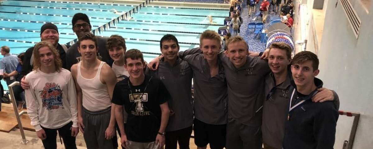 Trumbull High coach Bill Strickland get together with swimmers Cameron Kosak, Rohit Gunda, Anthony Lemma, David Datz, Shane Miller, Raj Padda, Alex Jozwa, Joey Vaitkus, Ryan Johnson and Liam Crecca.