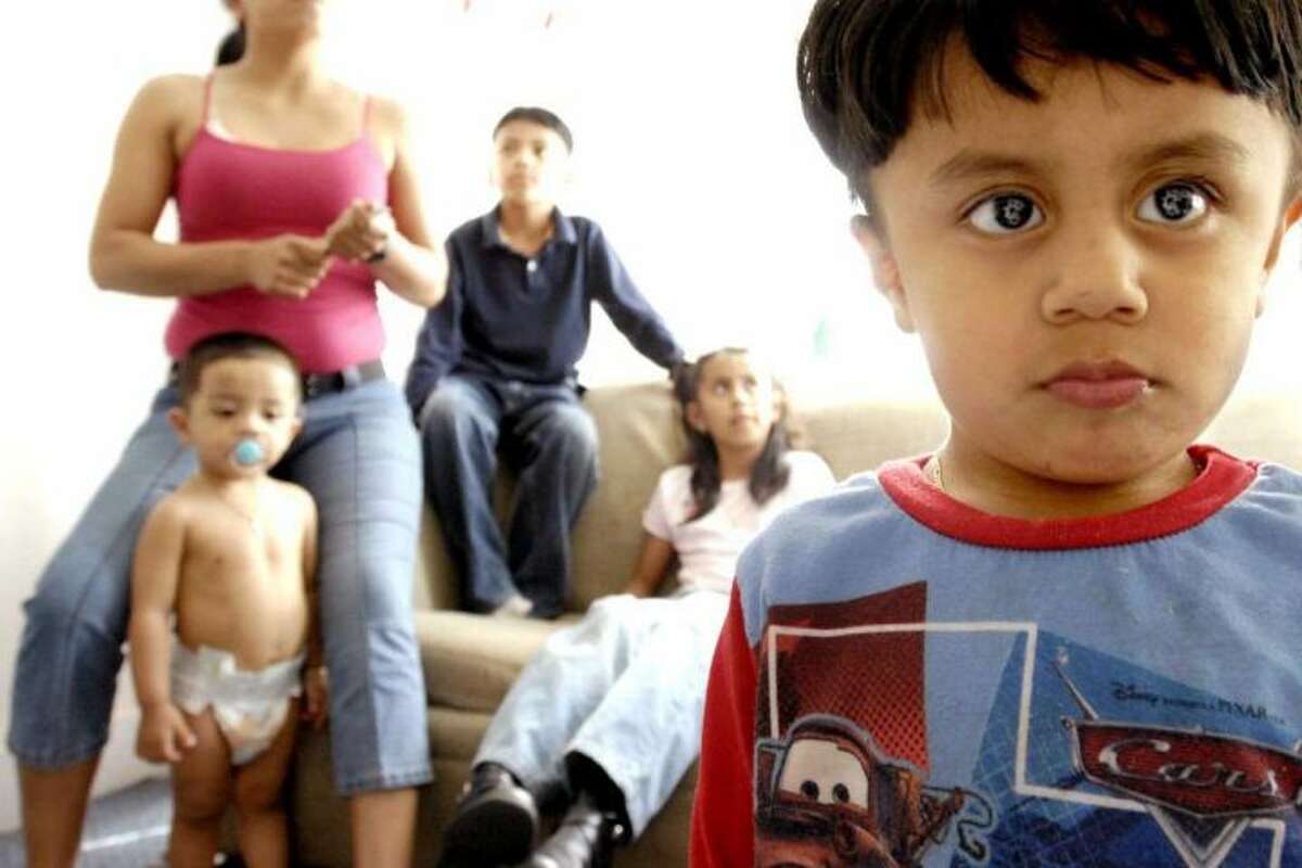 n a file photo, children of undocumented immigrants from Mexico are shown in their New Haven home. The American Civil Liberties Union on Wednesday issued a report indicating that police in several Connecticut towns have cooperated with immigration officials; monitoring the location of undocumented individuals.