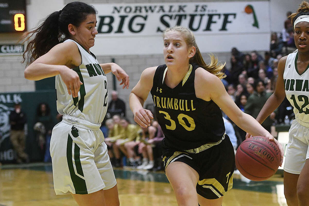 Trumbull's Allison Palmieri drives to the hoop while Norwalk's Ashley Wilson defends during the regular season meeting between the league's top two seeds. - Brian A. Pounds/Hearst Connecticut Media photo