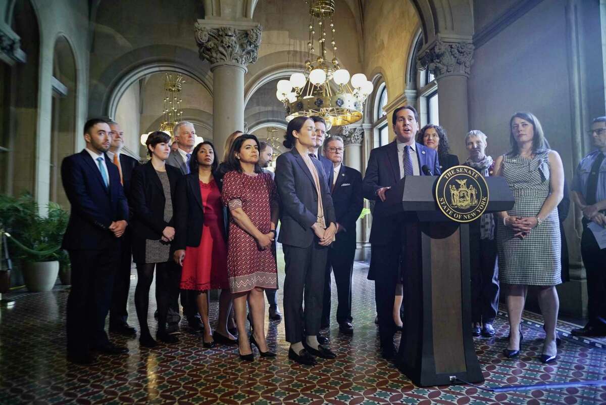 Senator Todd Kaminsky, at podium, the Chair of Environmental Conservation Committee, along with fellow Senators, Assembly members and supporters of climate legislation hold a press conference to discuss their push for legislation on Tuesday, June 4, 2019, in Albany, N.Y. (Paul Buckowski/Times Union)