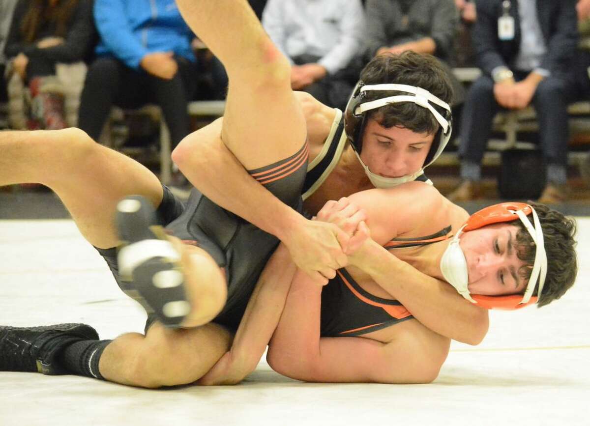 Trumbull's David Castaldo, winning here versus Shelton, scored a key victory in the match with Newtown. — David G. Whitham photo