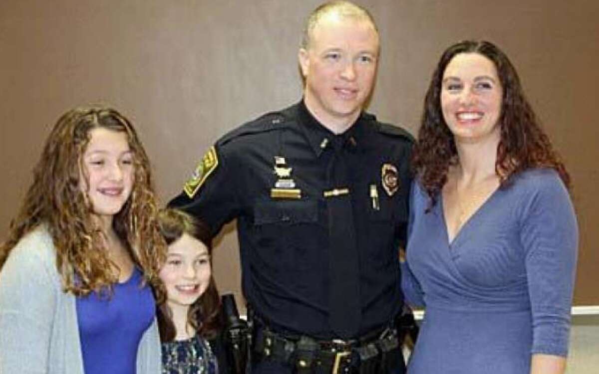 The Trumbull Police Department recently promoted Sgt. Donald Allen to the rank of lieutenant. Attending the ceremony were his parents and family. Allen stands with his wife Heather and daughters Aprile and Ashlie.
