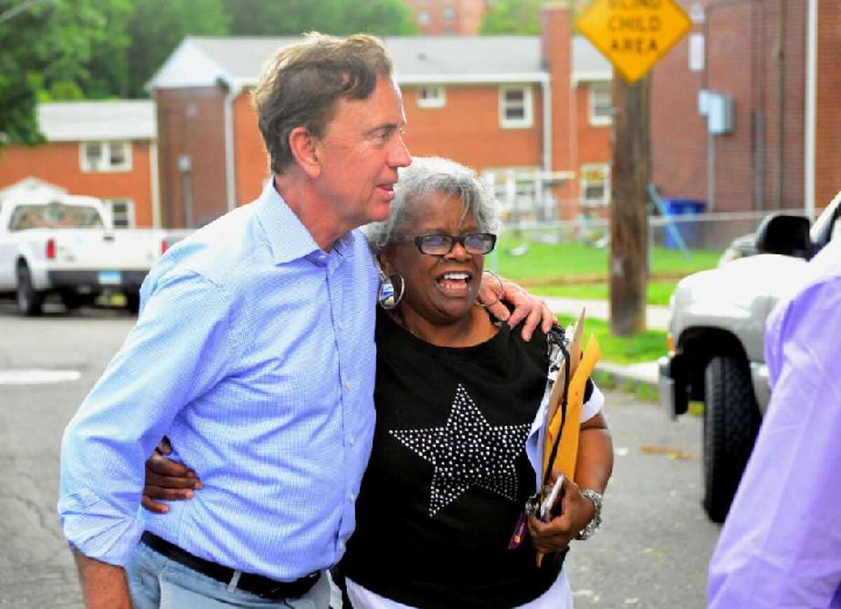 Ned Lamont greets a motorist as he and State Senator Marilyn Moore greet residents at the Second Stoneridge co-op, during a campaign stop at the co-op on Yaremich Drive in Bridgeport, Conn., on Tuesday, June 5, 2018.