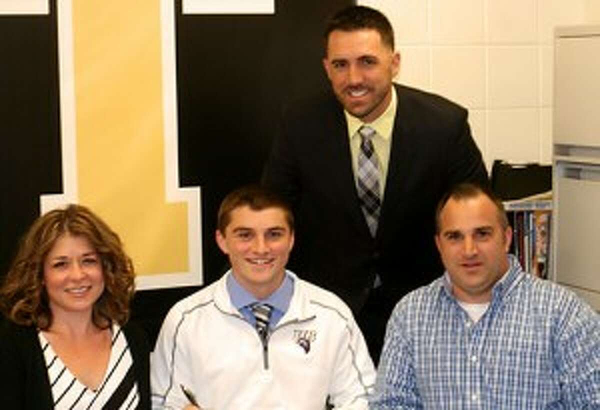 Alex Rauso is joined by his mom Cathy and dad Alex and Legion coach Brett Conner when the Trumbull High catcher signed his letter to attend the University of Bridgeport. Missing from photo is Trumbull High coach Phil Pacelli. - Bill Bloxsom photo