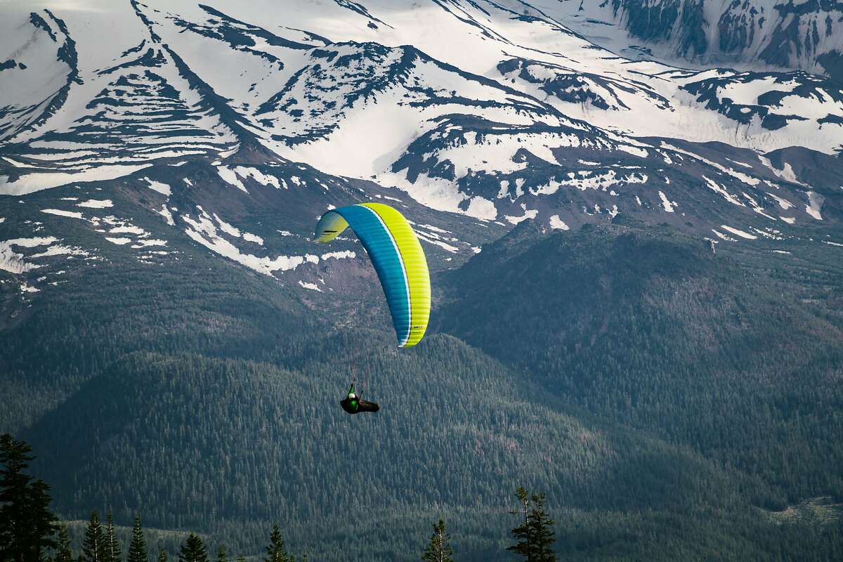 Paragliding pilot Troy Bainbridge cruises near Mt. Shasta.