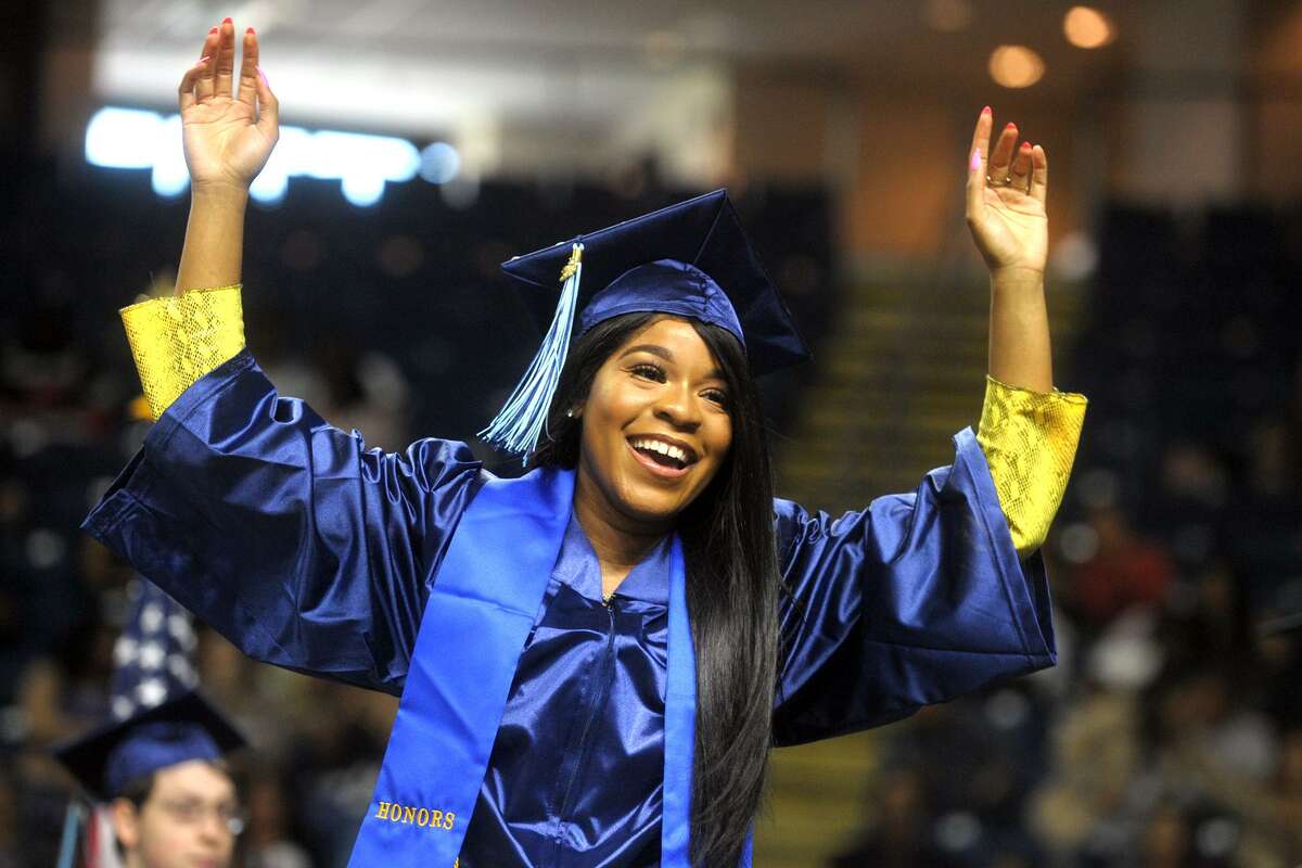 Erika Robinson, of Norwalk, celebrates as she come forward to receiver her diploma Commencement for the Housatonic Community College Class of 2019, held at Webster Bank Arena in Bridgeport, Conn. May 22. 2019.