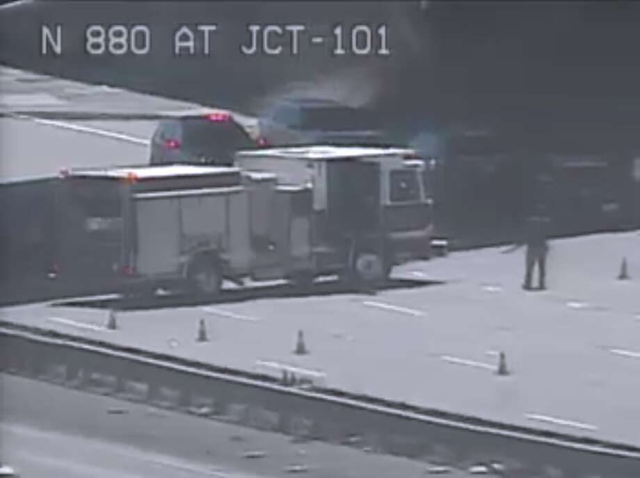 Firefighters at the scene of the interchange I-800 and Highway 101, where a man was hit by several cars on Tuesday morning. Photo: Caltrans