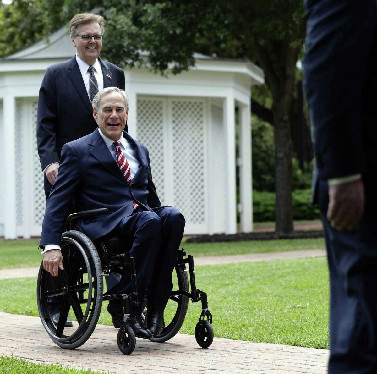 Gov. Greg Abbott, right, Lt. Governor Dan Patrick, center, and Speaker of the House Dennis Bonnen, left, arrive for a joint news conference to discuss teacher pay and school finance at the Texas Governor's Mansion in Austin, Texas, Thursday, May 23, 2019, in Austin. (AP Photo/Eric Gay)