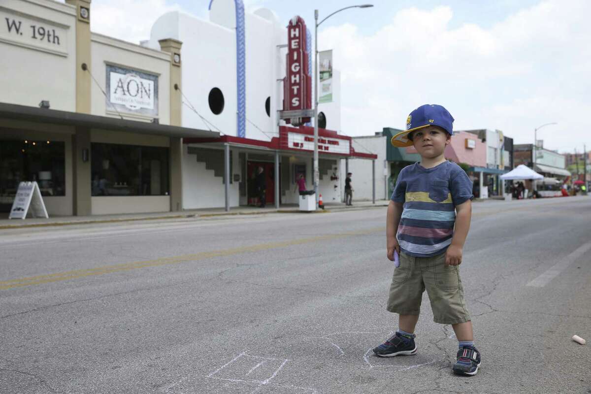 Eli Mechling, 2, draws with chalk on the 19th Street of the Heights at the Cigna Sunday Streets Houston on Sunday, March 25, 2018, in Houston. Cigna Sunday Streets Houston blocked motor vehicles from Heights Boulevard to Shepherd Drive on the 19th Street and reserved the stretch of the street for cycling, walking, dancing, socializing. ( Yi-Chin Lee / Houston Chronicle )