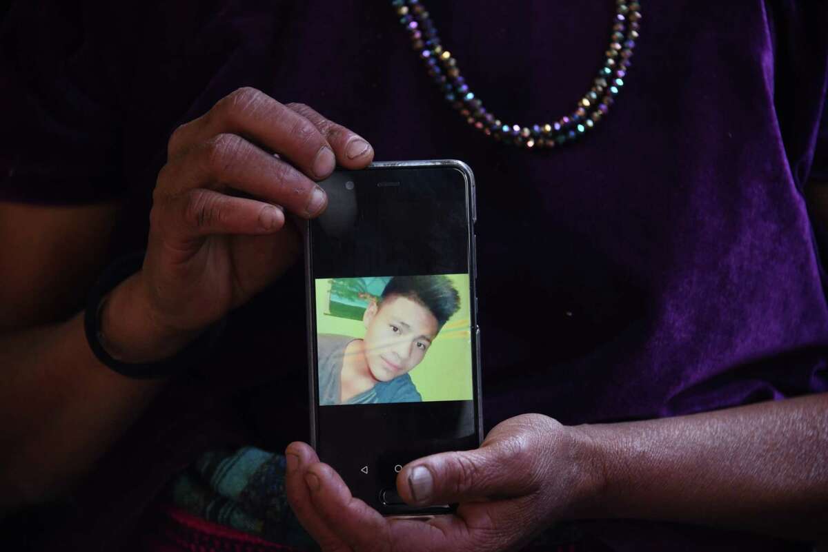 Rigoberta Vasquez, mother of 16-year-old migrant Carlos Hernandez Vasquez, shows a photo of her son, who died in border-patrol custody.
