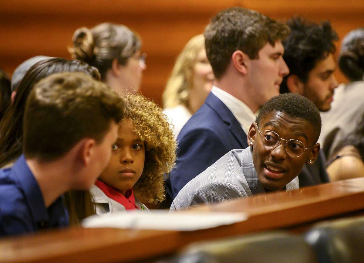 Youth plaintiffs in the Juliana v United States climate change lawsuit gather in a federal courthouse for a hearing in front of a panel of judges with the 9th Circuit Court of Appeals in Portland, Ore., on Tuesday, June 4, 2019. The lawsuit by a group of young people who say U.S. energy policies are causing climate change and hurting their future faces a major hurdle Tuesday as lawyers for the Trump administration argue to stop the case from moving forward. (Robin Loznak/Pool Photo via AP)