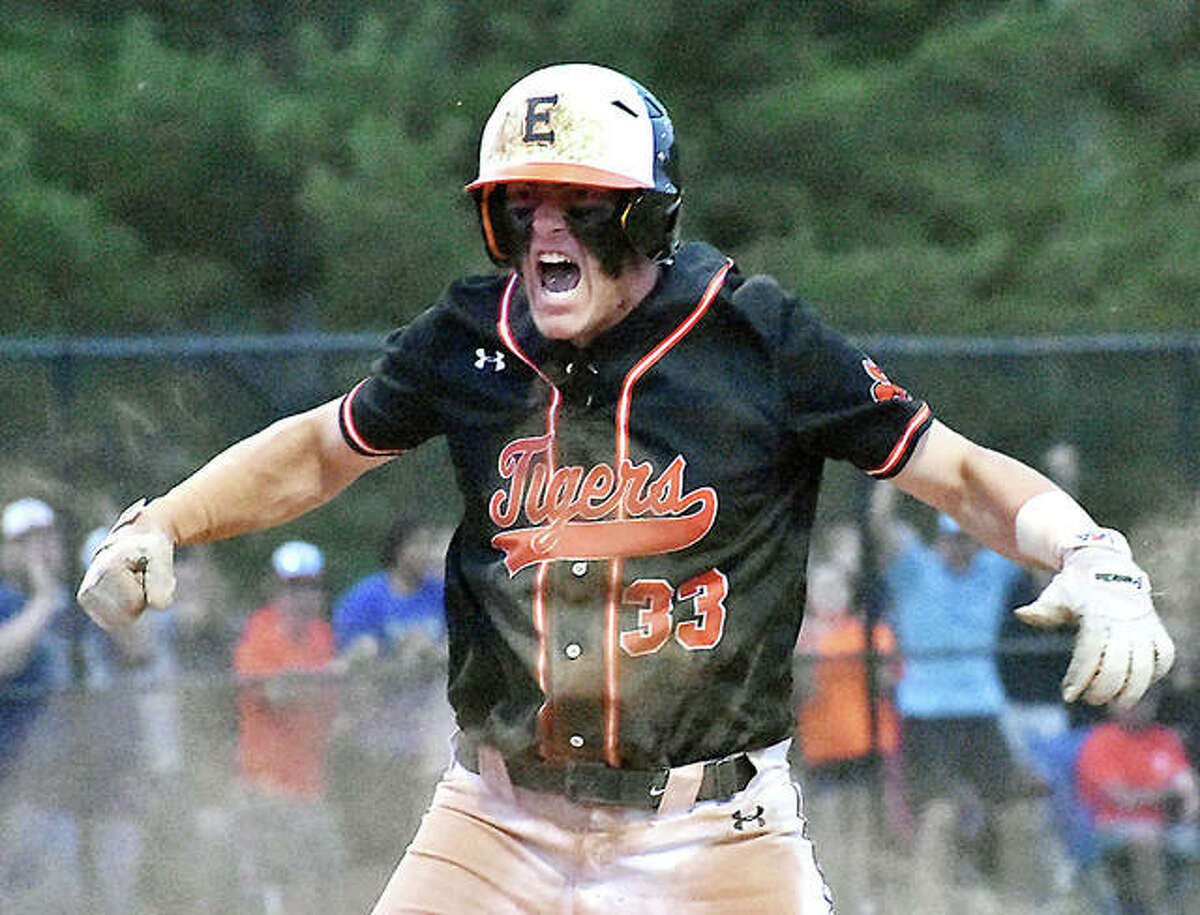 Edwardsville first baseman Drake Westcott celebrates after scoring the go-ahead run in the seventh inning against Marist on Monday in Springfield.
