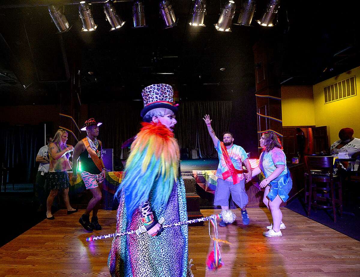 Debutantes dance after their introduction in The Red Room at Pride Fest 2018. The annual event, hosted by PFLAG Beaumont, kicked off with an Equality March to the Crockett Street Entertainment Complex. Food trucks, vendors, information booths, performance artists, music and drag shows indoors and out rounded out the activities to celebrate equality, diversity and LGBT pride. Photo taken Saturday, June 9, 2018 Kim Brent/The Enterprise