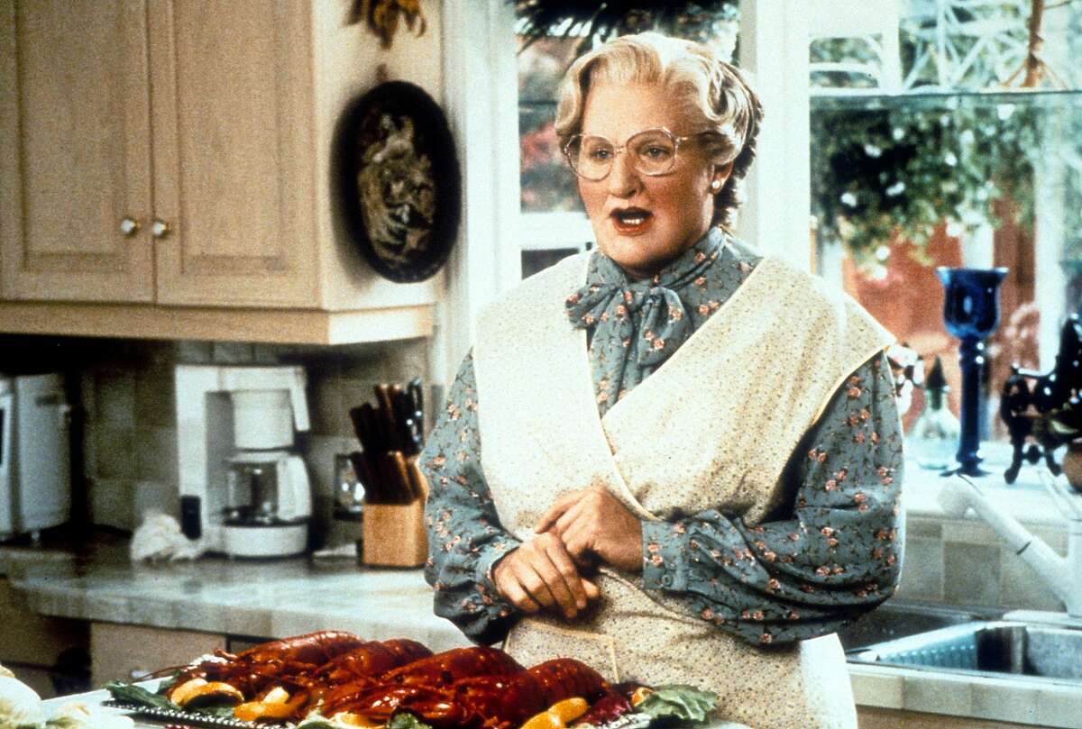 Robin Williams in the kitchen in a scene from the film 'Mrs. Doubtfire', 1993.