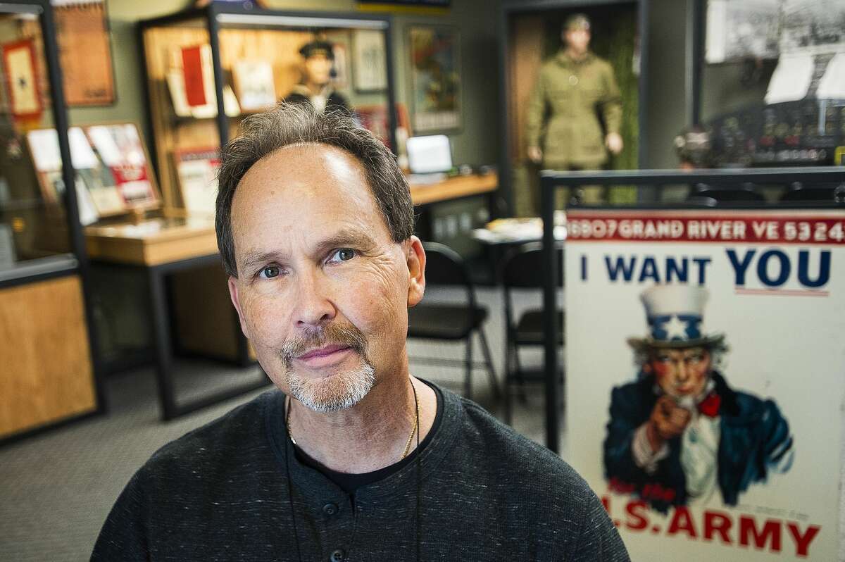 Steve Berge of Midland poses for a portrait among his collection of World War II memorabilia inside the Veterans Recognition Center & Museum in Midland on Wednesday, June 5, 2019. The exhibit, called "D-Day Remembered," is open from 10 a.m. to 4 p.m., every day through June 11. After June 11, Berge said the D-Day tribute will remain on display every Tuesday for at least the next three months. (Katy Kildee/kkildee@mdn.net)