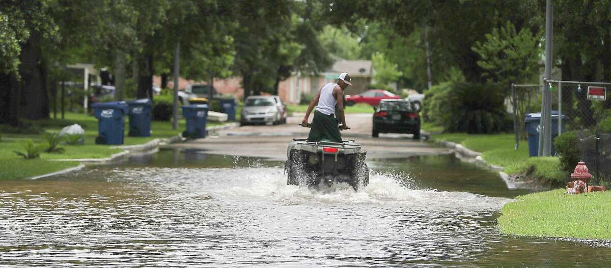 An ATV was used to enter a flooded neighborhood Wednesday, June 5, 2019, in Kendleton.