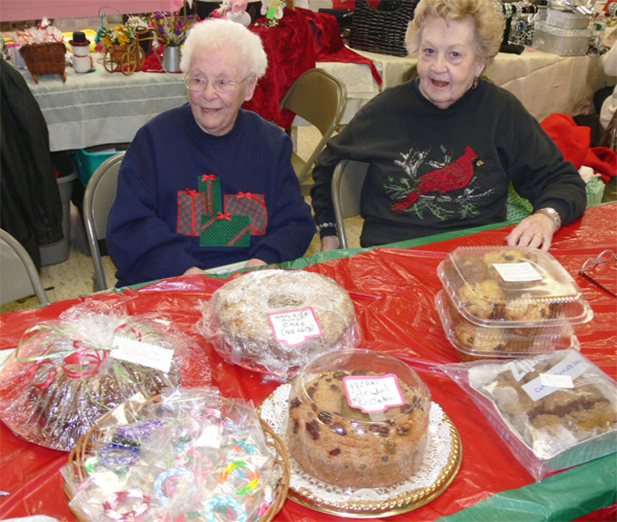 Offering a variety of freshly based goods made by St. Margaret Mary Church members are Loretta Harris, left, and Marjorie Chulak.
