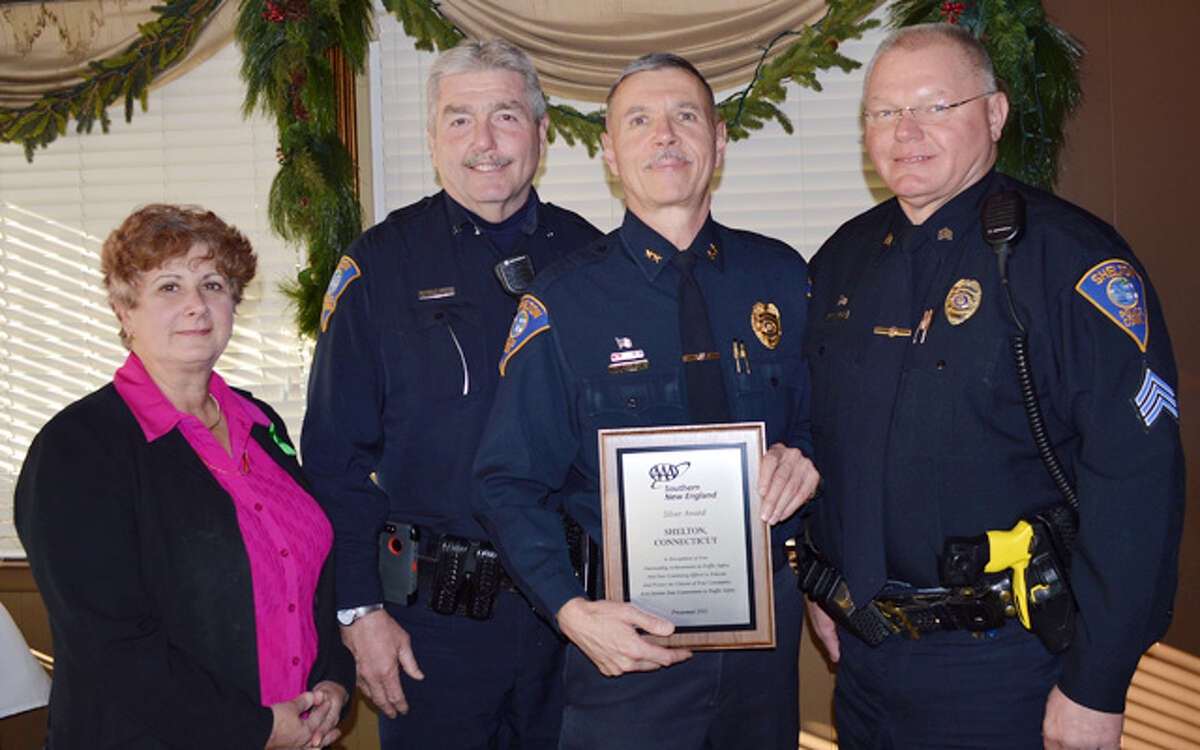From left, local AAA Public Affairs Manager Fran Mayko presents the SIlver Award to, from left, the Shelton Police Department's officer Mark Siglinger, Chief Joel Hurliman and Sgt. Pete Zaksewicz. Siglinger and Zaksewicz are certified AAA driving improvement program instructors.