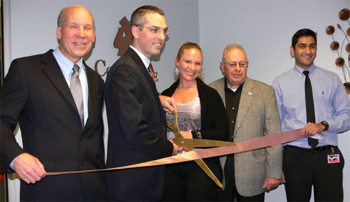 At the ribbon-cutting ceremony for the new office of Concierge Tax Services in Shelton are, from left, Greater Valley Chamber of Commerce President Bill Purcell, Concierge Tax Services owner Robert Gambardella, Robert’s wife Jennifer, Board of Aldermen President John Anglace, and the company’s Hersh Parikh.