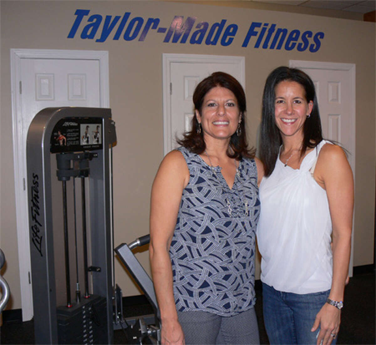 Taylor-Made Fitness co-owners Renee Daconto, left, and Patricia Taylor inside the new facility on Bridgeport Avenue.