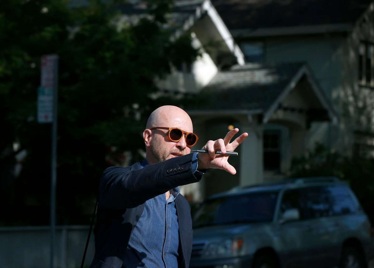 Architect and urban planner Daniel Parolek takes a walking tour to view multi-unit dwellings in the Rockridge and Fairview Park neighborhoods of Oakland, Calif. on Wednesday, May 1, 2019.
