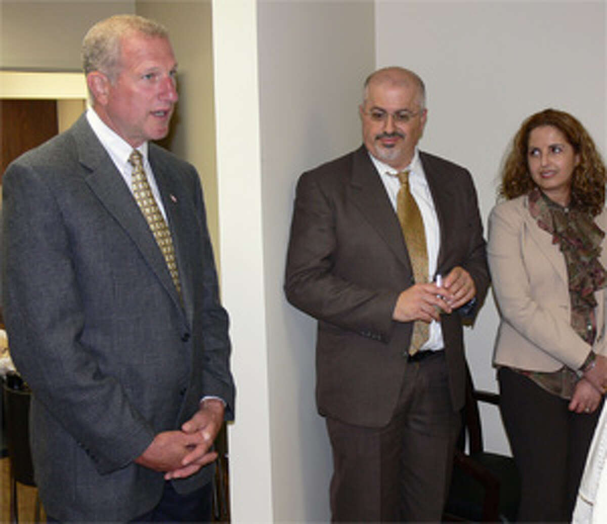 Mayor Mark Lauretti welcomes husband-and-wife Drs. Nami Bayan and Ladan Hamd to Shelton at the Wednesday event.