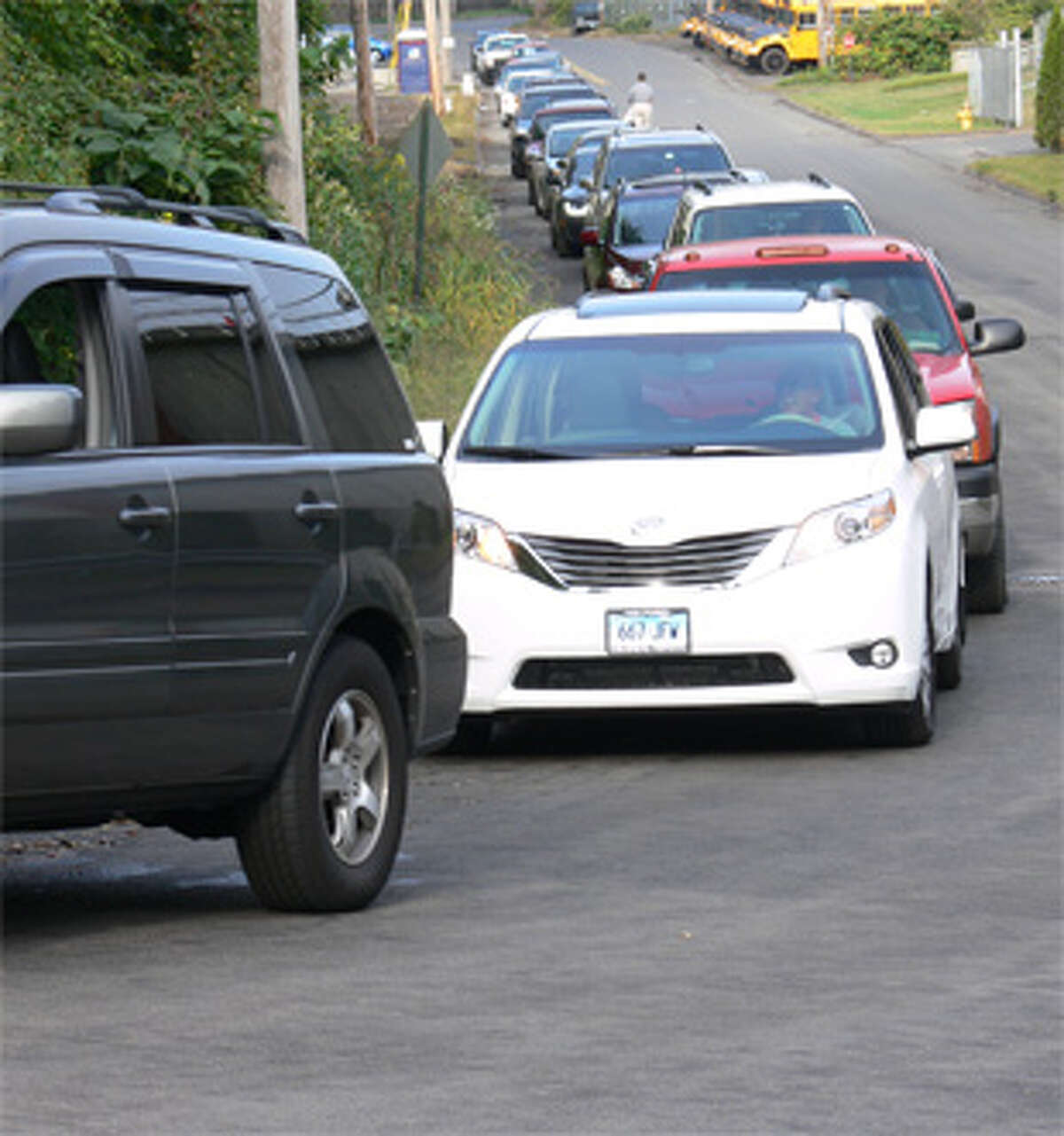 Vehicles line up on Riverdale Avenue as drivers wait to drop off items during the annual collection on Oct. 5.