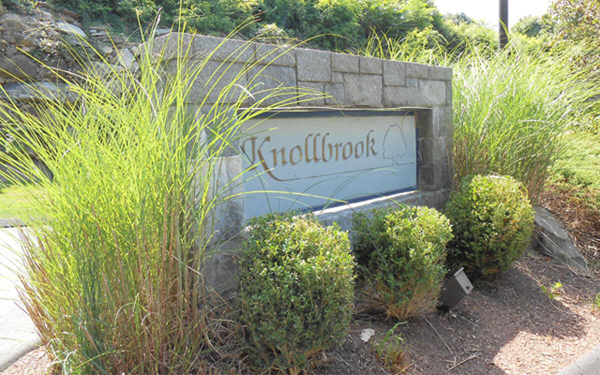 The entrance to Knollbrook Condominiums, a 71-unit complex on Old Bridgeport Road.
