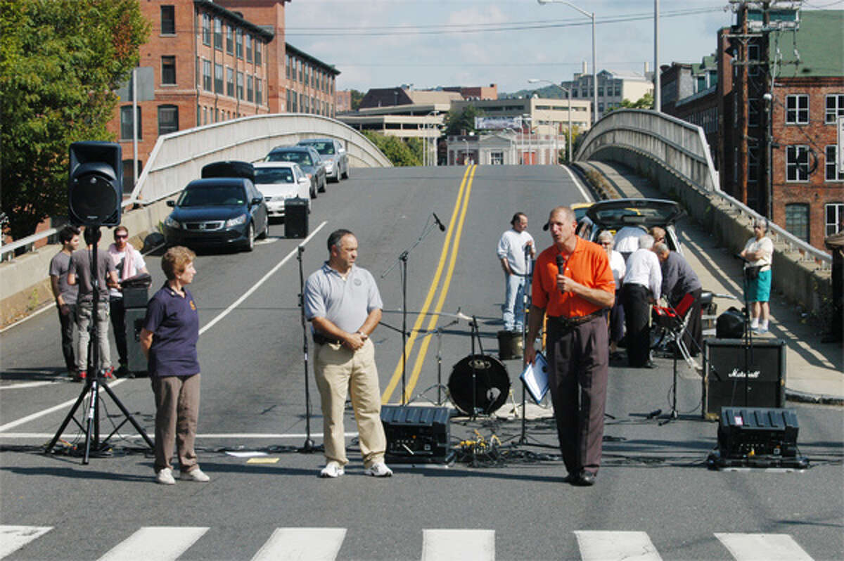 Mayor Mark Lauretti addresses people from Bridge Street and Howe Avenue — where bands perform — during a past Shelton Day.