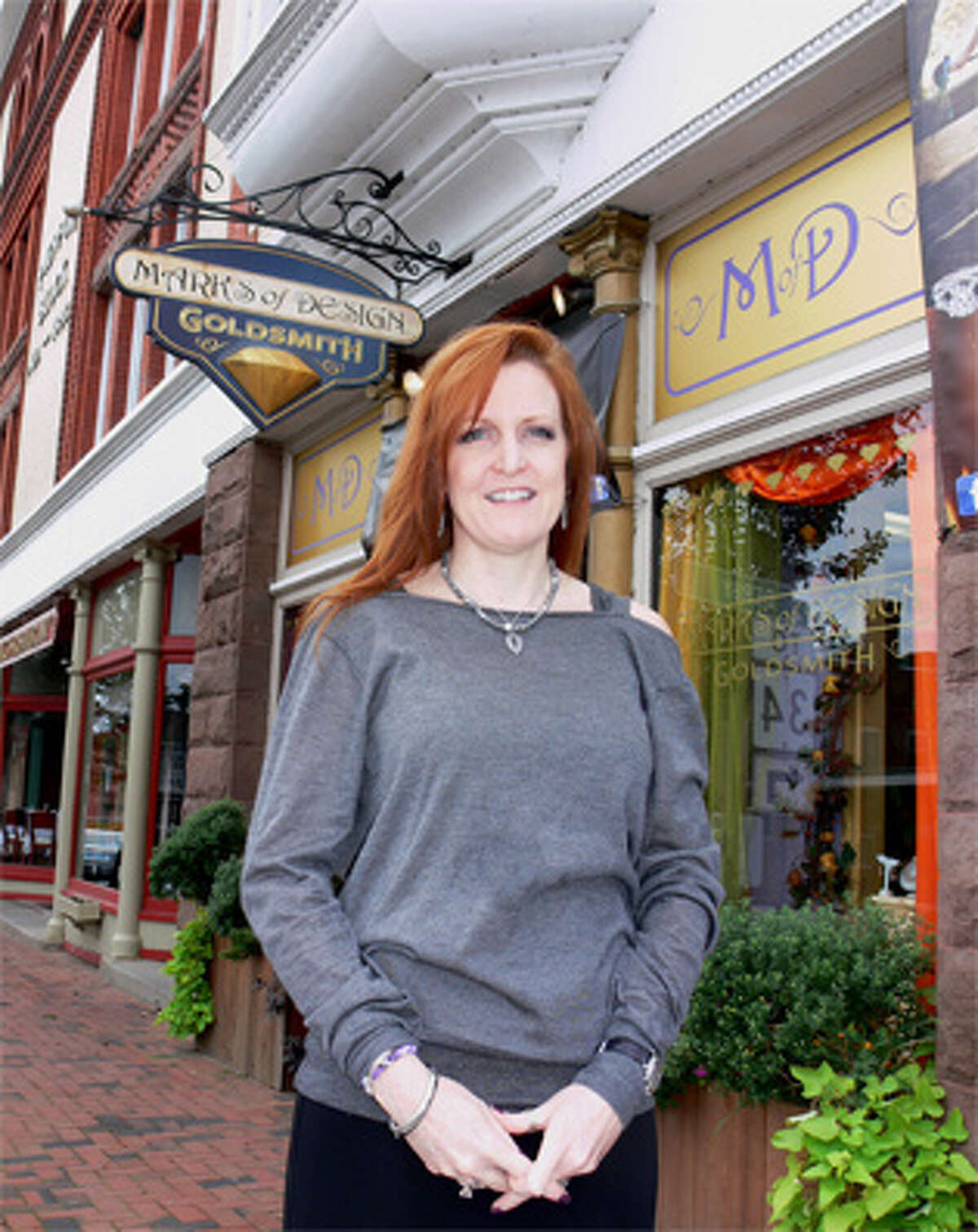 Marks of Design owner Kate Marks outside the Howe Avenue retail establishment, now in its 14th year of operation.