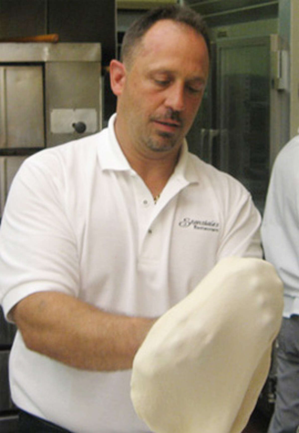Don Stanziale, a 1983 Shelton High graduate, makes pizza at his restaurant where will the class reunion will take place Oct. 5.