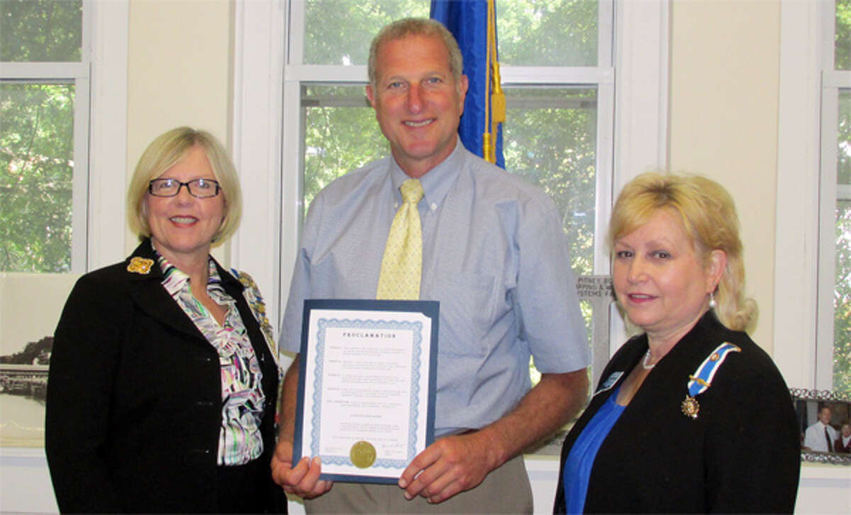 Mayor Mark Lauretti, holding a proclamation declaring Constitution Week from Sept. 17 to 23 in Shelton, with Daughters of the American Revolution local chapter Regent Christy Hendrie, left, and chapter member Linda Papp.