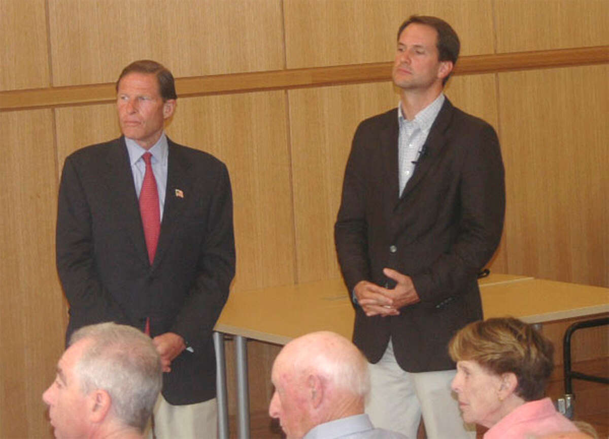 U.S. Sen. Richard Blumenthal, left, and U.S. Rep. Jim Himes listen to constituents discuss whether the United States should take military action against Syria during a Sunday town meeting in Darien.