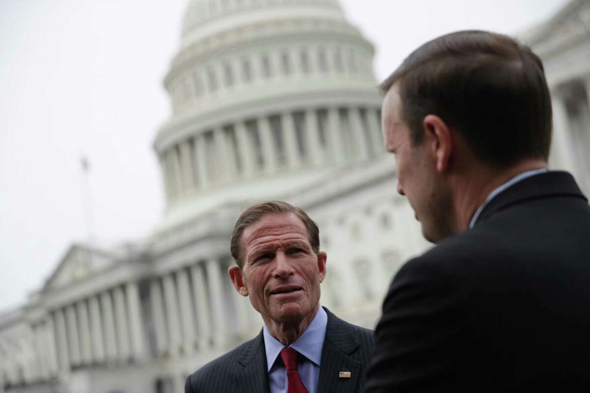 U.S. Sen. Chris Murphy, D-Conn., right, talks to Sen. Richard Blumenthal, D-Conn., prior to a news conference June 5, 2019 on Capitol Hill in Washington, D.C.