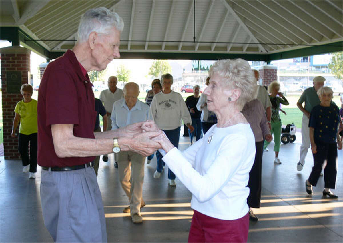 Gene and Nancy Sabados of Shelton dance together during the Shelton Senior Center event at Veterans Memorial Park.