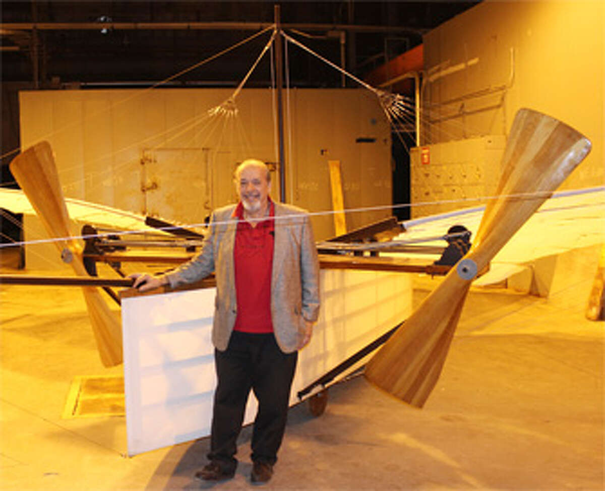 Andy Kosch with a replica of Gustave Whitehead’s No. 21, now recognized by Jane’s All the World’s Aircraft as the first powered aircraft to leave the ground, at the Connecticut Air and Space Museum in Stratford. (Photo by John Kovach)