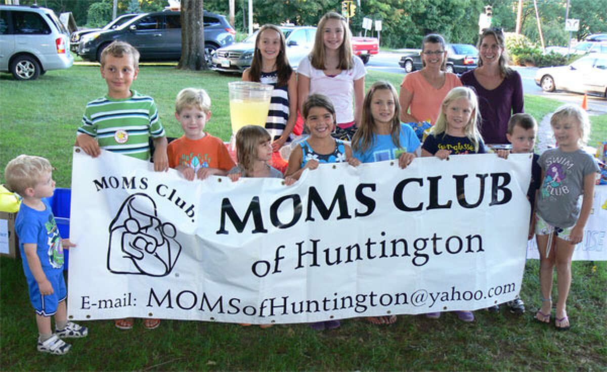 Members of the Moms Club of Huntington and their families sold lemonade during the Aug. 14 concert to raise money for Spooner House. The club pursues a similar service project every month.