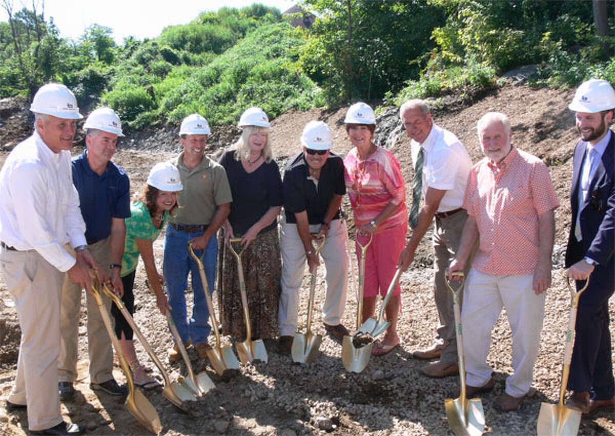 Animal Shelter Building Committee members pose with city officials and those involved in the design and construction during the ground-breaking ceremony.