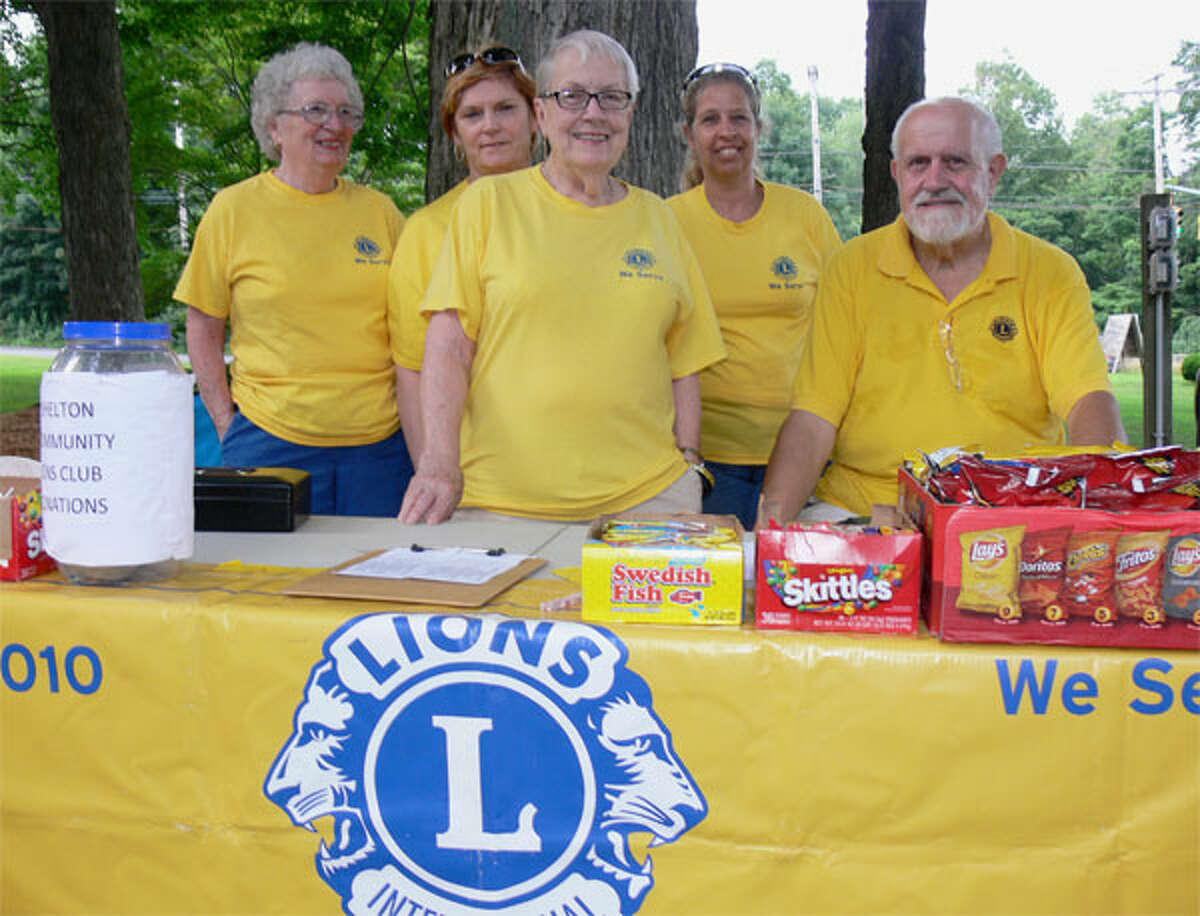 Staffing the Shelton Community Lions Club table at a Huntington Green concert are, from left, Barbara Osterhoudt, Rebecca Twombly, Natalie Skinner, Laura Blakeman (secretary), and David Haddad (president).