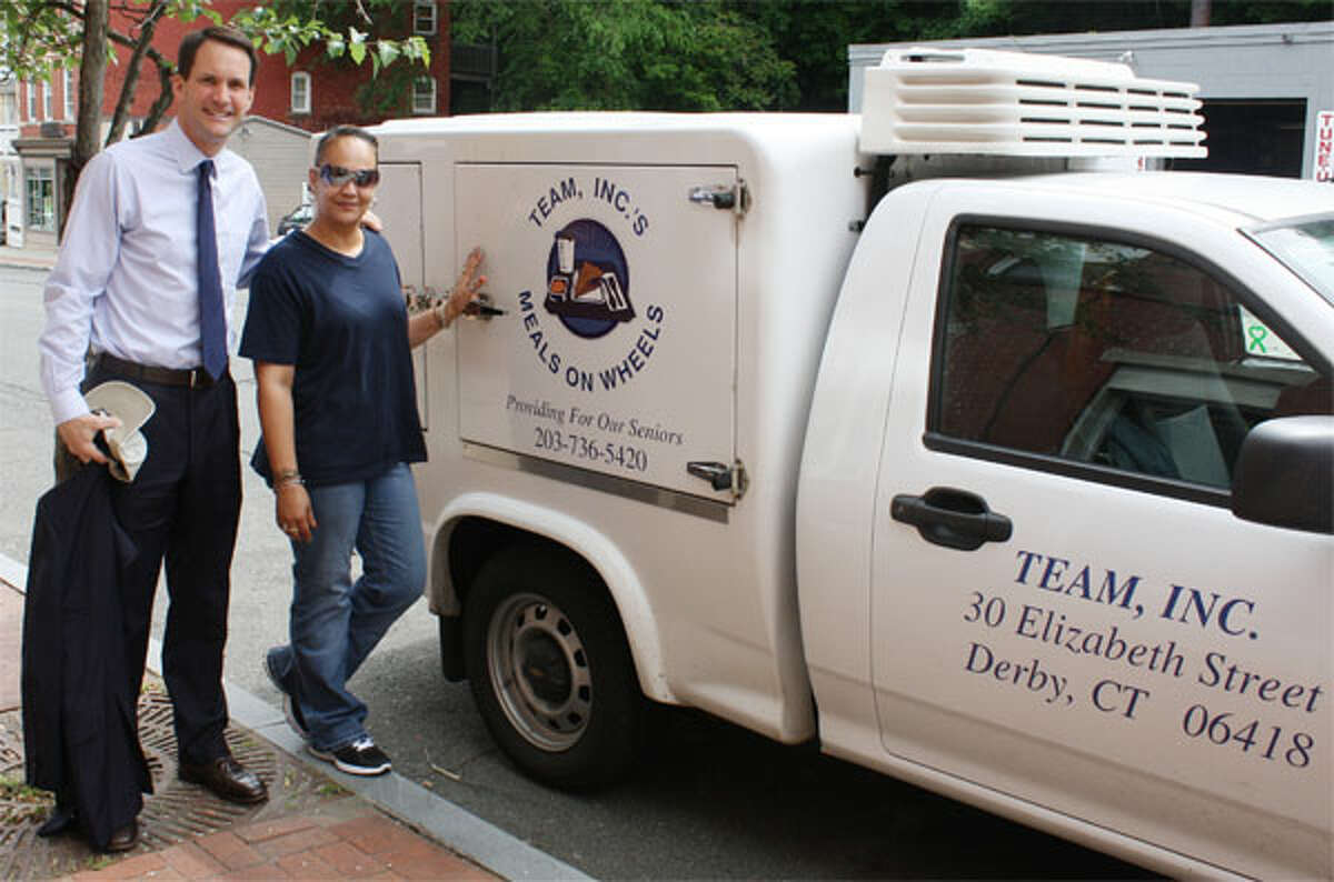 Congressman Jim Himes and TEAM driver Suzette Oquendo deliver Meals on Wheels to elderly who are homebound in Shelton.
